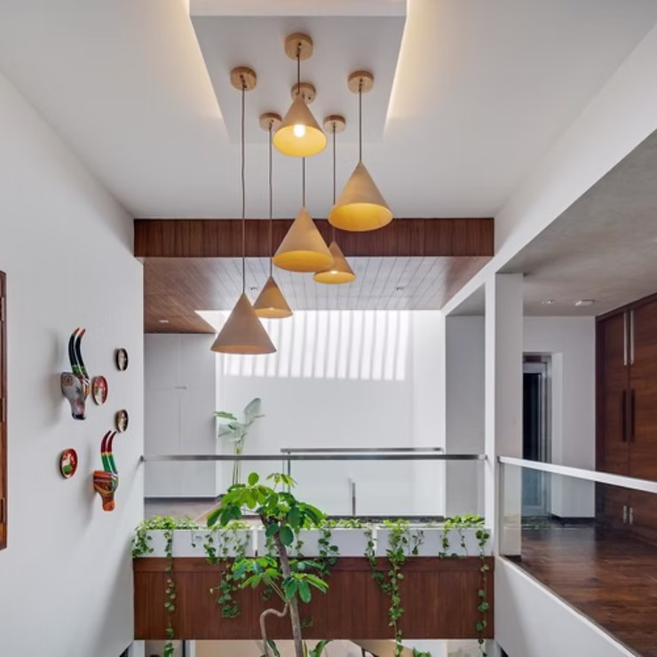 Gypsum false ceiling design with LED cove lighting in Madurai home
