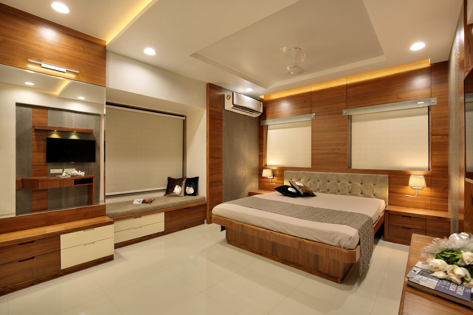 Master bedroom interior design in Madurai &mdash; full wardrobe wall with integrated lighting by Furnhomes, serving Dindigul and Theni