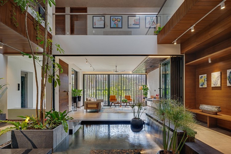 Living room with fluted wall panel TV unit and cove ceiling lighting Madurai Furnhomes