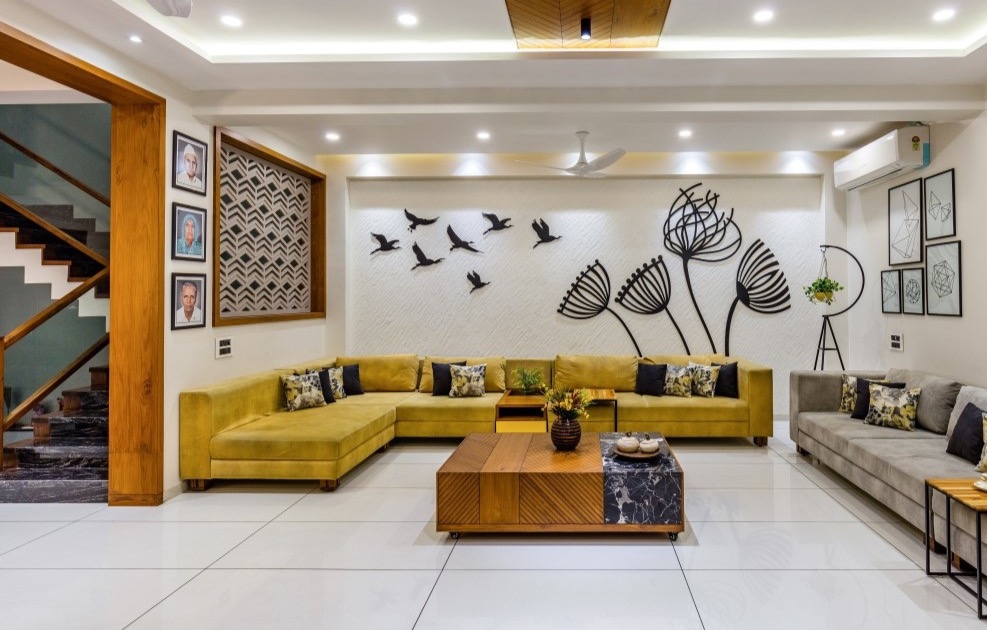 Open plan living room sofa arrangement and TV wall Madurai by Furnhomes